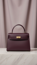 Leather handbag in deep plum